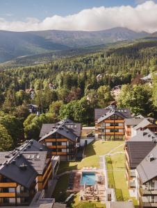 an aerial view of a resort with mountains in the background at Tremonti Hotel Karpacz in Karpacz