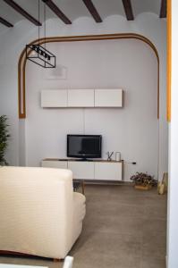 TV a/nebo společenská místnost v ubytování Casa vacacional El Sol + 15 fotografií
