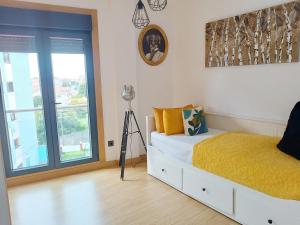 Posteľ alebo postele v izbe v ubytovaní Fridda House Rias Baixas Vigo