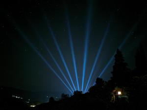 Una luz azul en el cielo por la noche en Traditional GuestHouse Permet, en Përmet