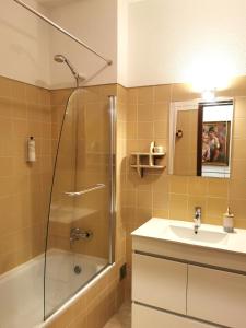 a bathroom with a shower and a sink at Gustavo's Place in Sines