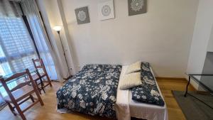 Łóżko lub łóżka w pokoju w obiekcie Deyanira Suite, Aeropuerto, IFEMA