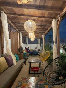 a living room with a couch and chairs and a table at Riad AL Bahi in Rabat