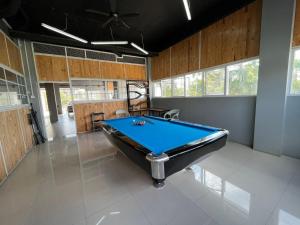 a billiard room with a pool table in it at Urbanview Hotel The Tang Balikpapan by RedDoorz in Balikpapan
