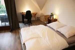 Postel nebo postele na pokoji v ubytování Messe- und Gästezimmer Hildesheim