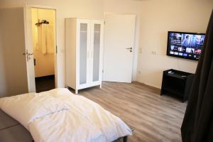 Postel nebo postele na pokoji v ubytování Messe- und Gästezimmer Hildesheim