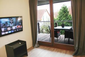 TV a/nebo společenská místnost v ubytování Messe- und Gästezimmer Hildesheim