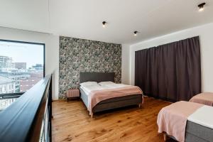 Postel nebo postele na pokoji v ubytování VV hotel & apartments