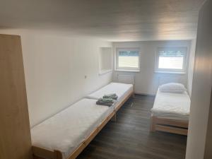 Katil atau katil-katil dalam bilik di Penzion Norden