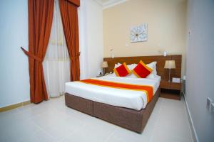 Ένα ή περισσότερα κρεβάτια σε δωμάτιο στο La Villa Hotel