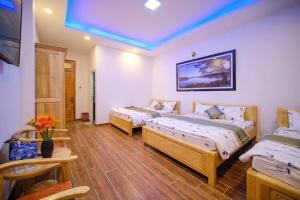 Postel nebo postele na pokoji v ubytování 688 Hotel Đà Lạt
