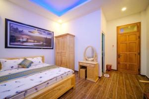Postel nebo postele na pokoji v ubytování 688 Hotel Đà Lạt