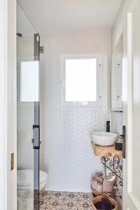 a bathroom with a shower and a sink at Casa Sierra - Mijas Pueblo in Mijas
