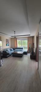 a large living room with couches and a large window at Apartment in Antalya Konyaaltı in Antalya