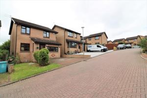 a brick driveway in front of a house at Signature - Binnie House in Cumbernauld
