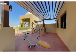 a playground in a house with aptionangering at bnbmehomes - Elegant Pool View - 2BR Apartment - 607 in Dubai