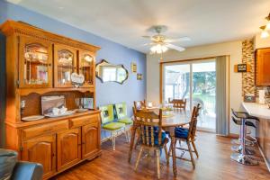 a kitchen and dining room with a table and chairs at Pennsylvania Countryside Retreat with Deck and Yard! in Emlenton