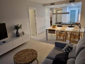 a living room with a couch and a table at Flamenca Village Resort apt 172 in Playa Flamenca