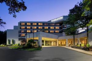 a rendering of a hotel building at night at Portland Sheraton at Sable Oaks in South Portland