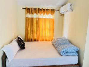 Postel nebo postele na pokoji v ubytování Prashiddha Resort