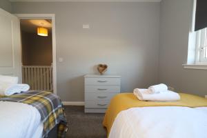 Cama o camas de una habitación en Signature - Whistleberry House