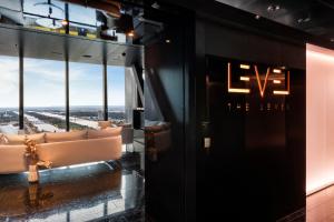 a room with couches and a sign on the wall at Melia Vienna in Vienna
