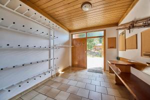 a room with a hallway with a wooden ceiling at Landhaus Eichenhof in Saalbach Hinterglemm