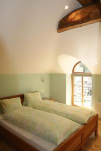 Giường trong phòng chung tại Albergo Piz Cam