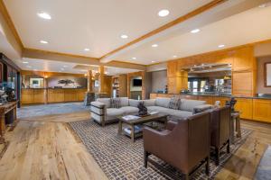 a living room with a couch and a table at Best Western Northwest Lodge in Boise