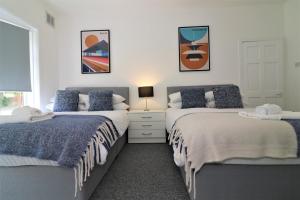 Postel nebo postele na pokoji v ubytování Signature - Gladsmuir View