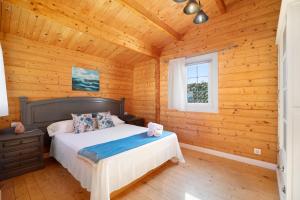 Postel nebo postele na pokoji v ubytování Villa fuego - Sólo familias + 21 fotografií