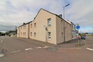 a building on the side of a street at Signature - Kirkhill House in Kirkmuirhill