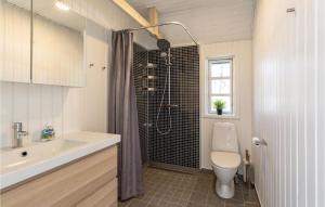 a bathroom with a shower and a toilet and a sink at Holiday Home Rørvig 01 in Rørvig