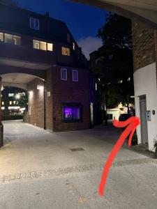 a red ribbon on the side of a building at 3 Bedroom Flat in King’s Cross, St Pancras’s. 2 minutes to Euston. in London