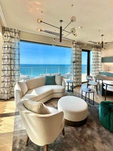 a living room with a couch and a table at Maximilian Suites in Trieste