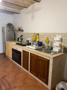 a kitchen with a sink and a counter top at Mini House Tagliacozzo in Tagliacozzo