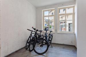a group of bikes parked in a room with a window at alter Speicher in Warendorf