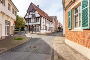an empty street in a town with buildings at alter Speicher in Warendorf