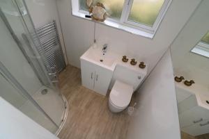 a bathroom with a toilet and a sink and a shower at Signature - Gordon House in Glasgow +37 photos