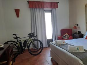 Postel nebo postele na pokoji v ubytování Hotel Boutique Cerro del Sol Adults only recommended