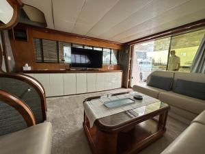 a living room with a couch and a coffee table at YACHT 20Metros in Barcelona