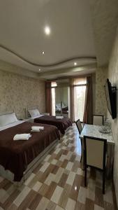 Postel nebo postele na pokoji v ubytování Hotel Tourist