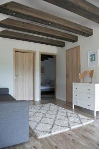 a room with a bed and a dresser and a bedroom at Panorama & Vino Szigliget in Szigliget