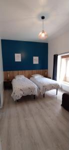 a room with two beds in the middle of a room at Domaine Moulin D' Elemiah in Gémozac +7 photos