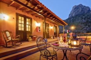 a patio with a table and chairs on a house at Tamahuche Hotel Rural in Vallehermoso +37 photos