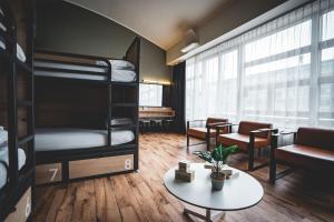 a dorm room with bunk beds and a table at Generator Dublin in Dublin