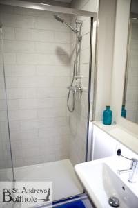 a bathroom with a shower and a sink at Luxury in the most convenient location in St Andrews in St. Andrews +20 photos