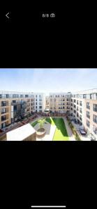 a view of a large apartment complex with buildings at Immaculate 2-Bed Apartment in Romford in Romford