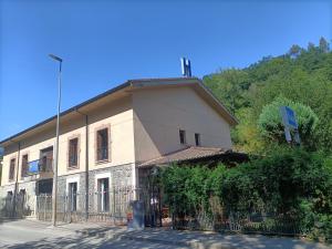 a building with a fence in front of it at Hotel Restaurante Ribera del Chicu in Arriondas