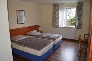 Un pat sau paturi într-o cameră la Eggersheimer Hof